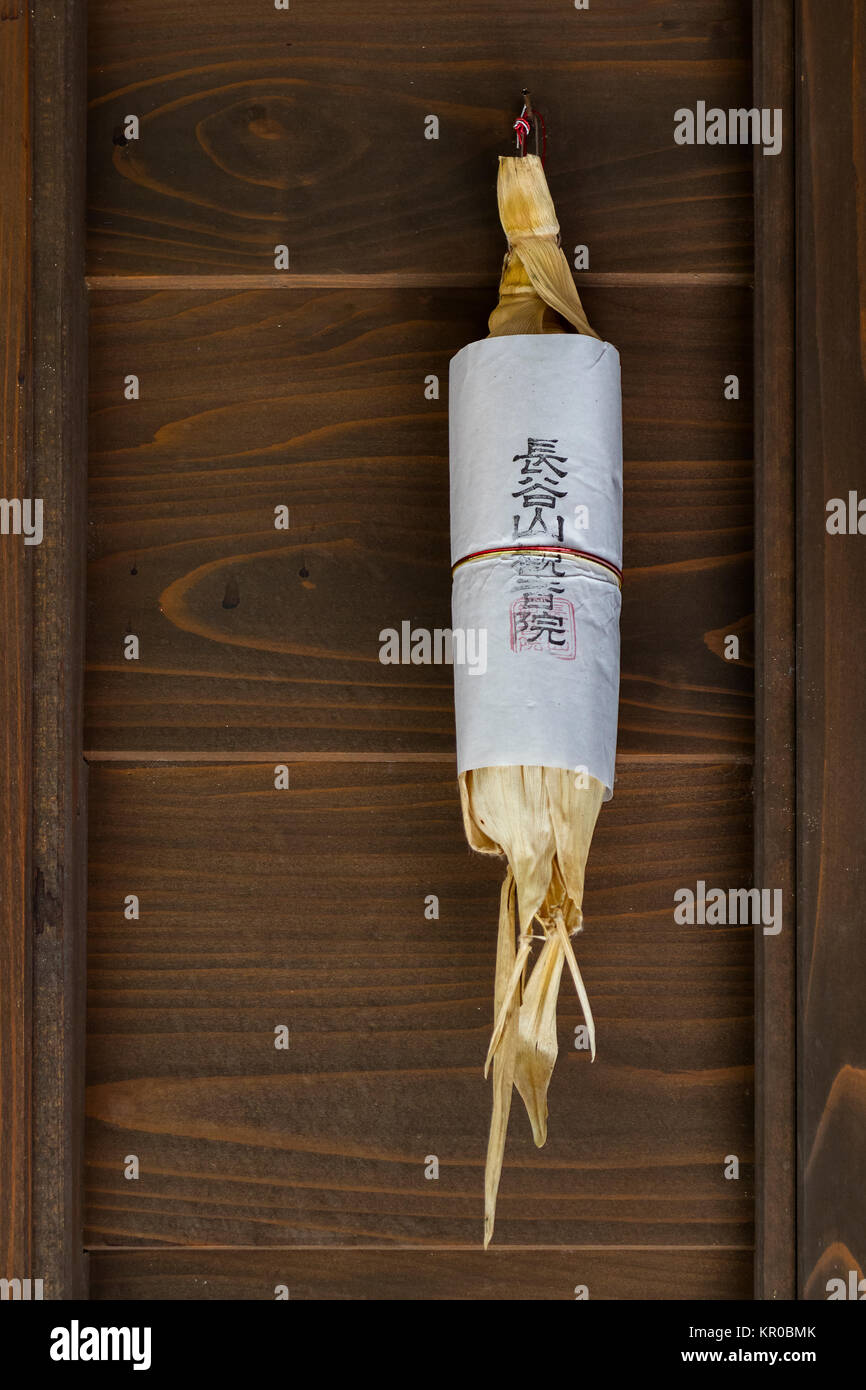 Kanazawa - Japan, June 11, 2017: Dried sweet corn hanging in doorway at merchant's house in Higashi Chaya area to protect againgst evil spirits Stock Photo