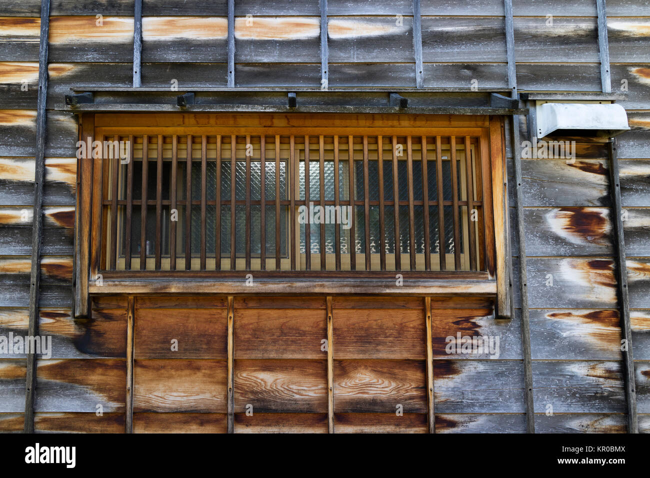 Kanazawa - Japan, June 11, 2017: Window with bars in a wooden two-story house in the historical Higashi Chaya District, Kanazawa City, Ishikawa Prefec Stock Photo
