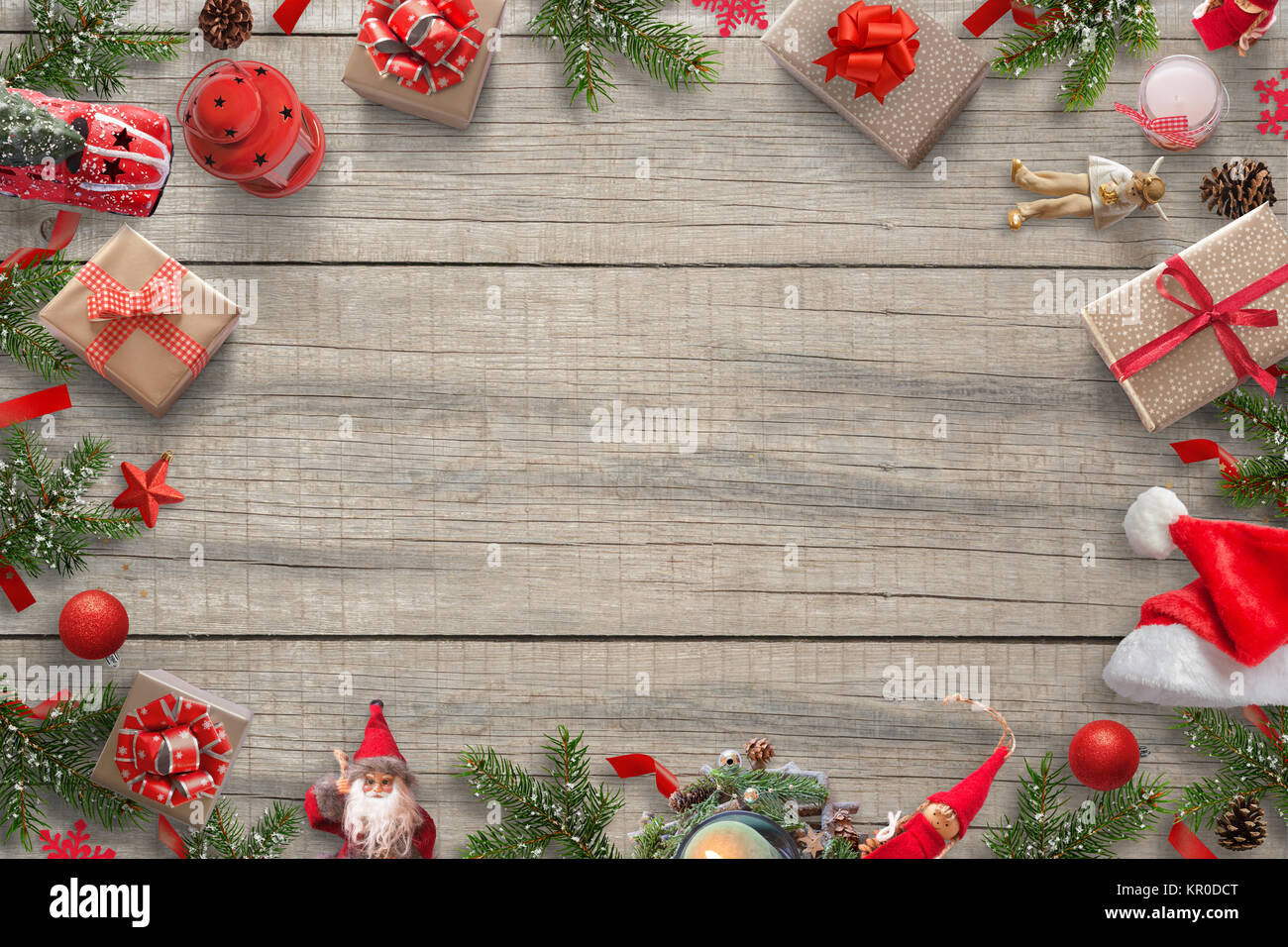 Christmas decorations background image with free space for greeting text.  Christmas tree, gifts, car, lantern; pinecones; Santa hat, doll and  Christma Stock Photo - Alamy