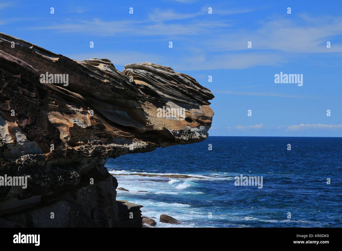 Cliff in Sydney and azure blue Pacific Stock Photo