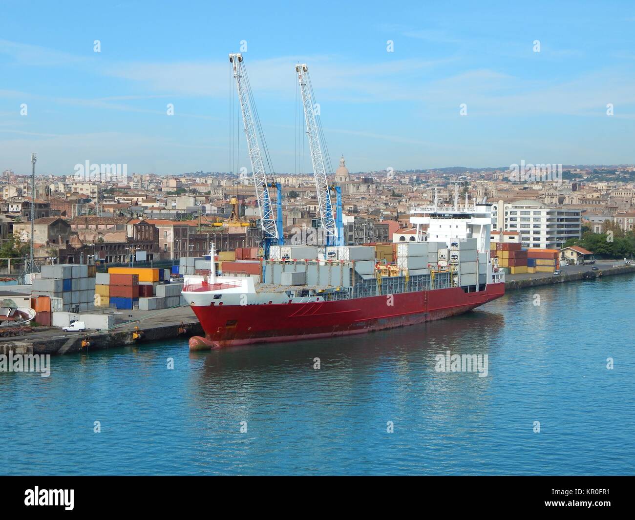 container ship being unloaded at the port of catania,sicily Stock Photo