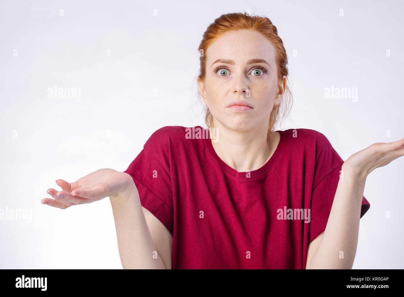 Confused Woman Looking At Camera And Gesturing With Hands White