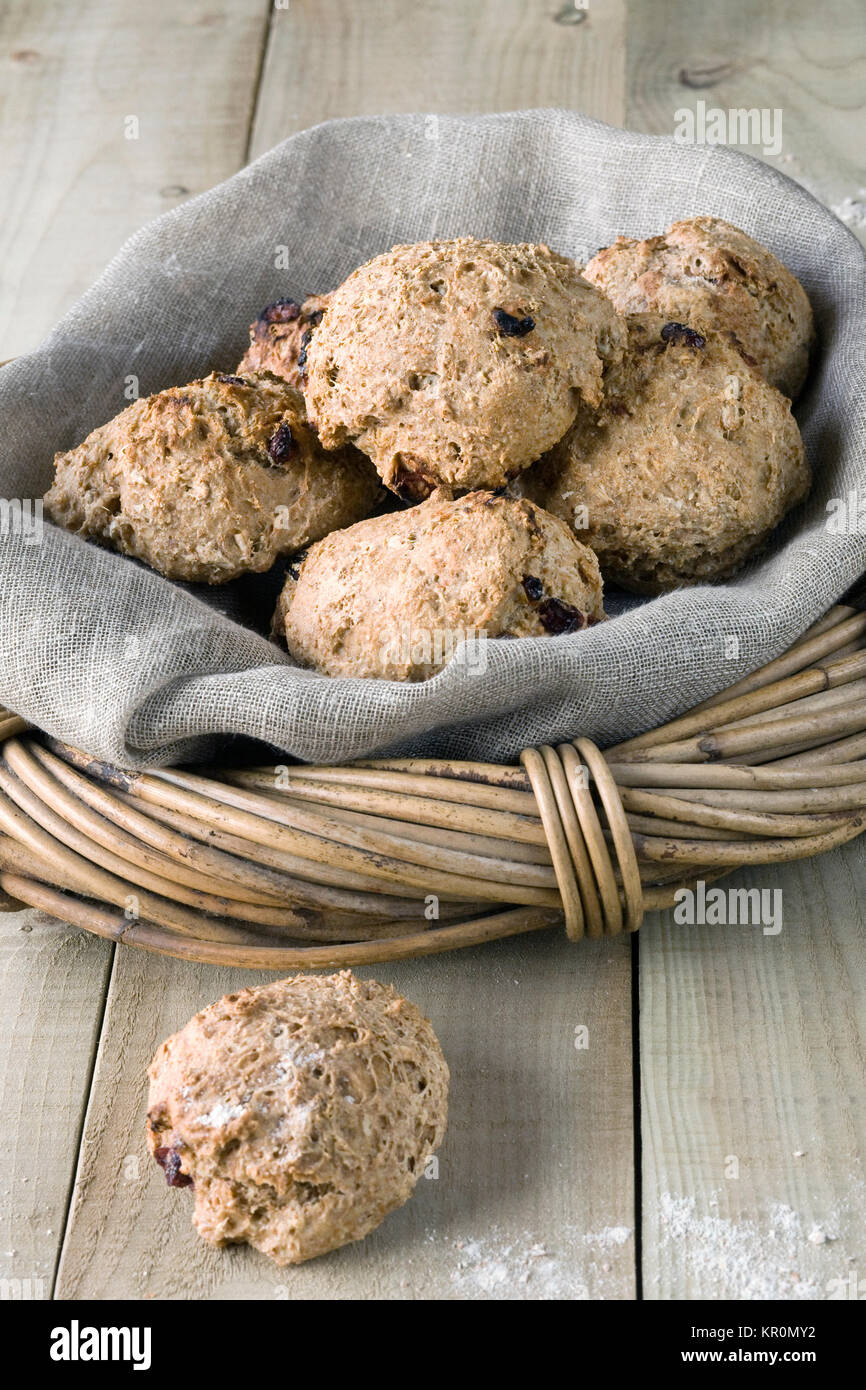 Homemade spelt and cranberry bread rolls in a basket. Stock Photo