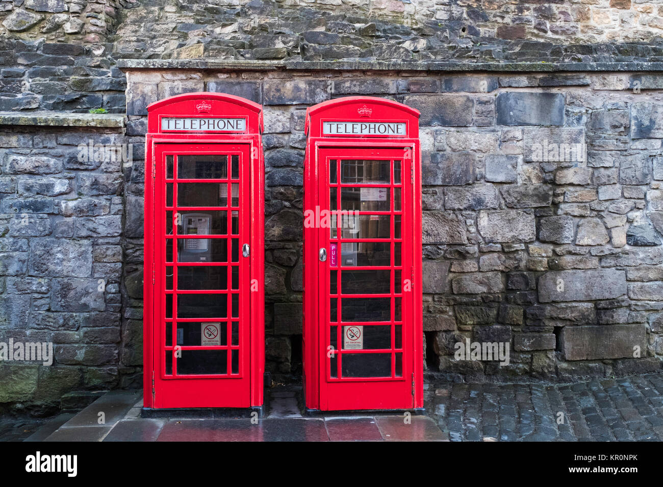 Two traditional red telephone boxes Stock Photo
