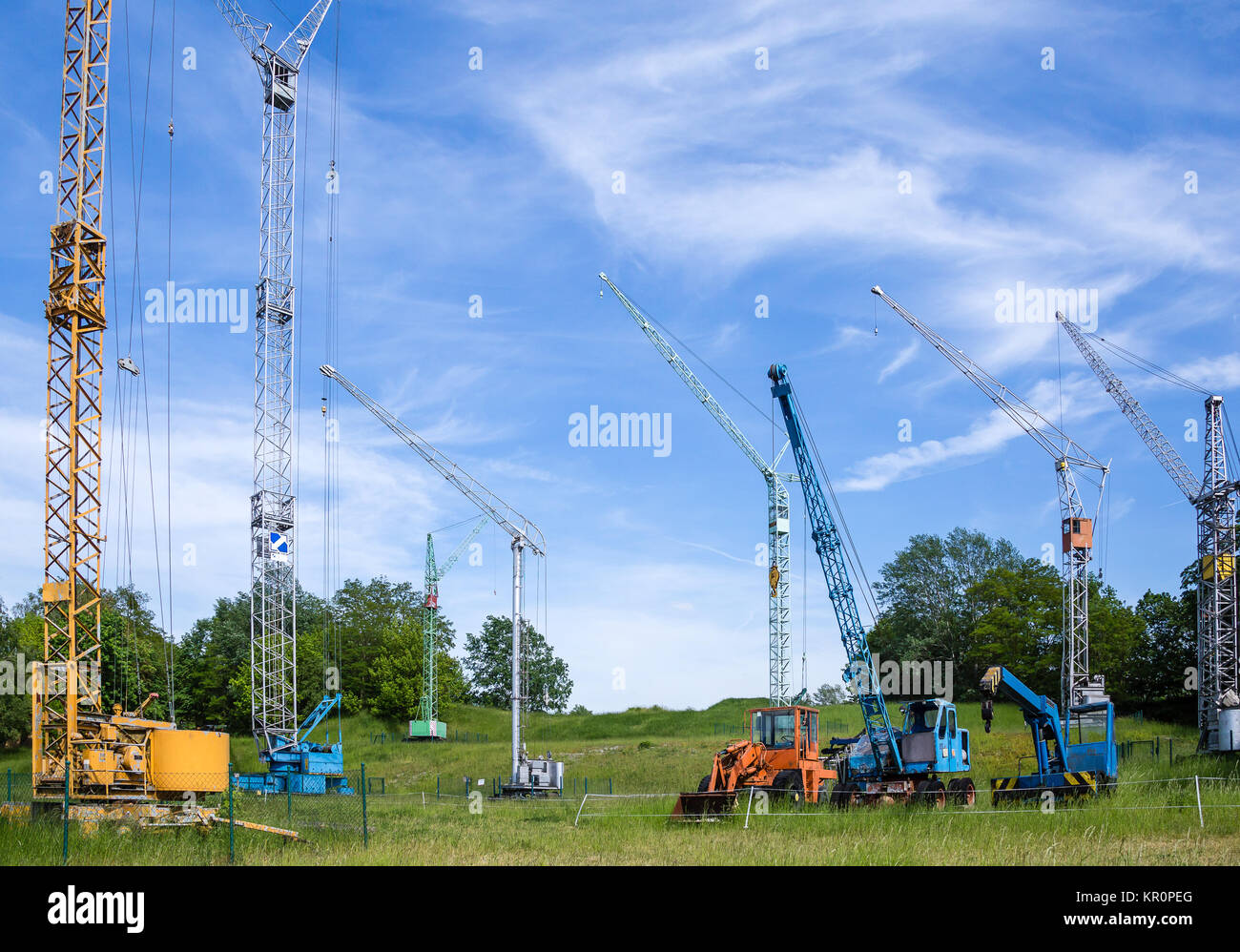 Detail of old cranes against a cloudy sky Stock Photo - Alamy