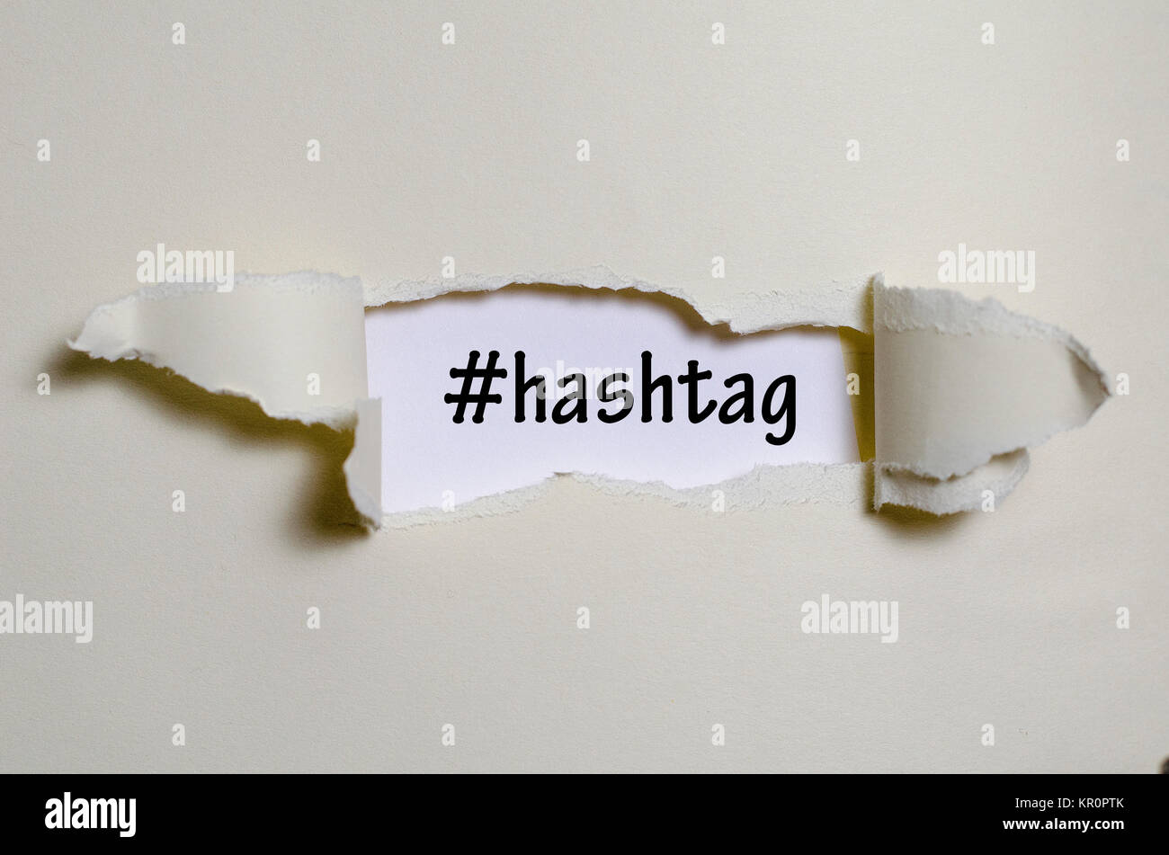 Hashtag Paper The word hashtag appearing behind torn paper Stock Photo - Alamy