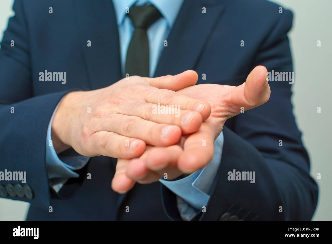 Man Rubbing Hands Together High Resolution Stock Photography and Images