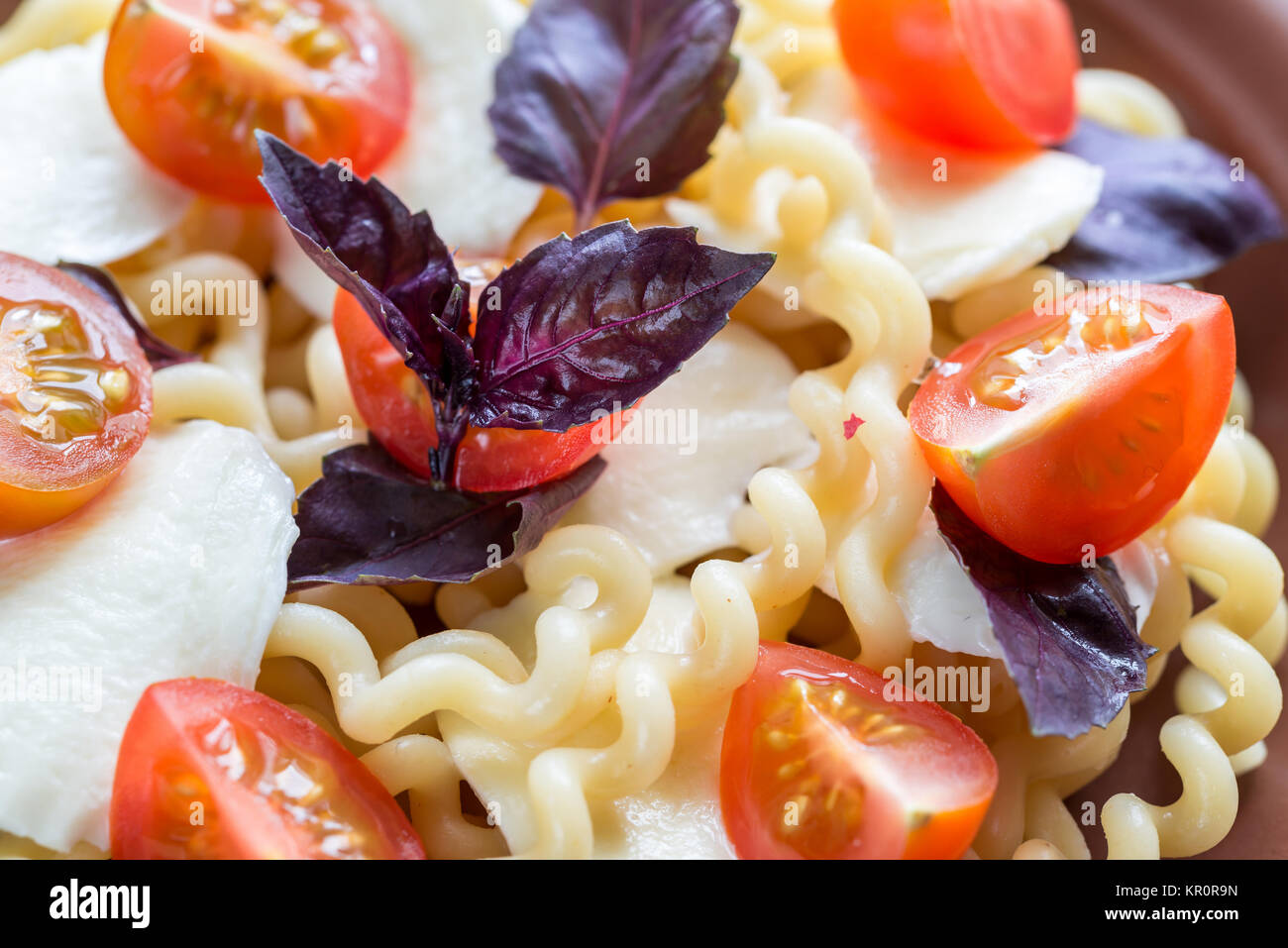 Fusilli lunghi with cheese and cherry tomatoes Stock Photo Alamy