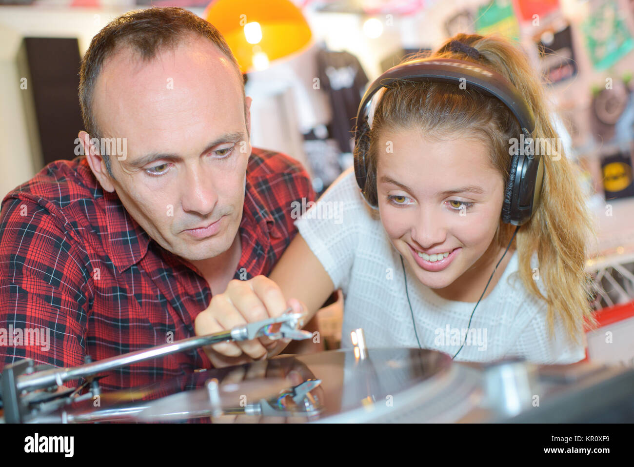 Girl playing a vinyl record Stock Photo