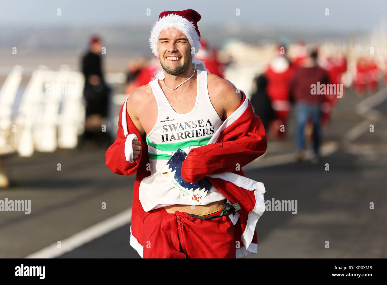 Pictured: Runners in Santa Claus fancy dress take part in this year's run in Aberavon, Wales, UK. Saturday 16 December 2017 Re: 500 people have taken  Stock Photo