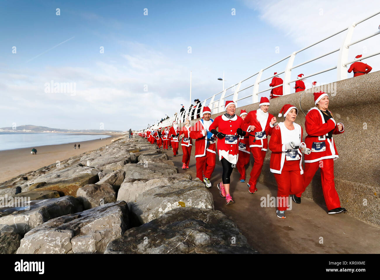 Pictured: Runners in Santa Claus fancy dress take part in this year's run in Aberavon, Wales, UK. Saturday 16 December 2017 Re: 500 people have taken  Stock Photo