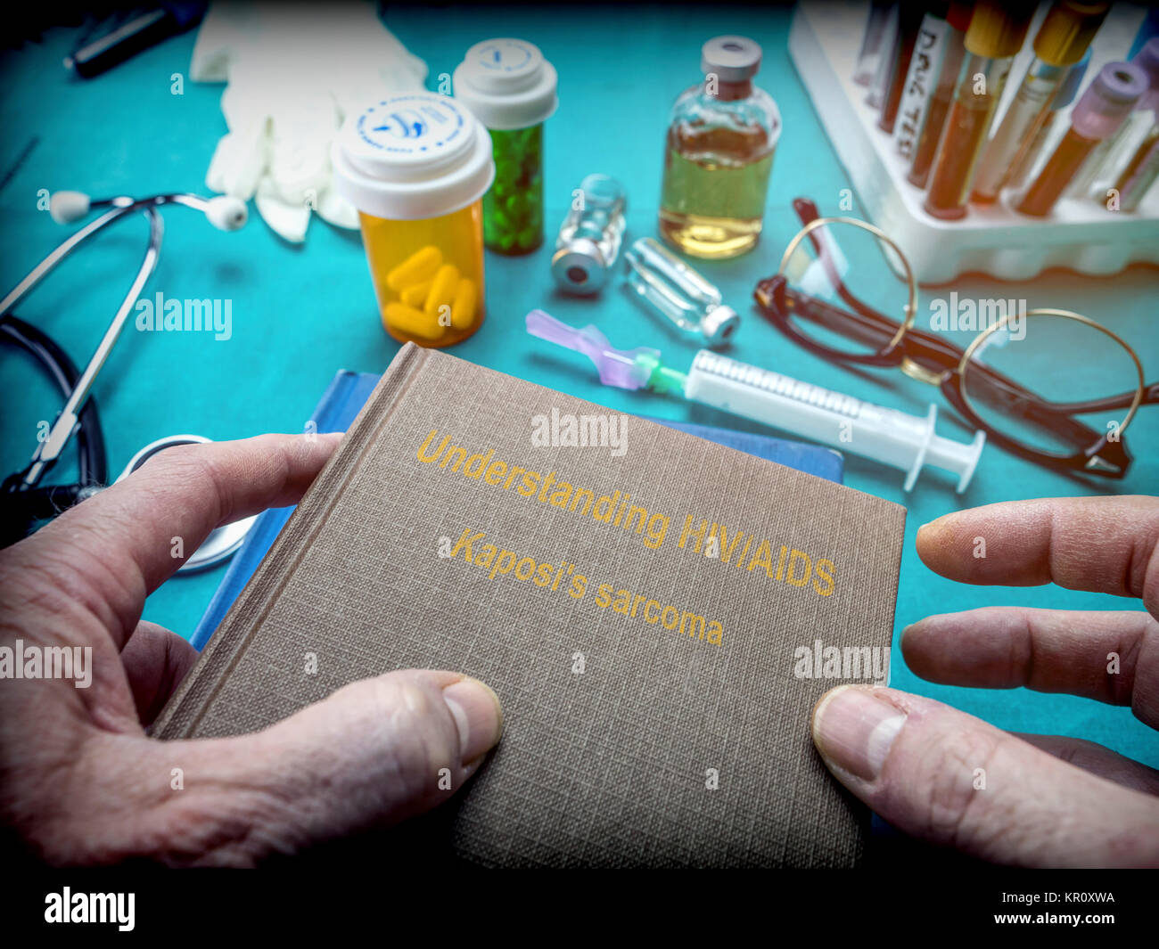 Doctor Holds Book of  HIV / AIDS sarcoma kaposi In A Hospital, conceptual image Stock Photo