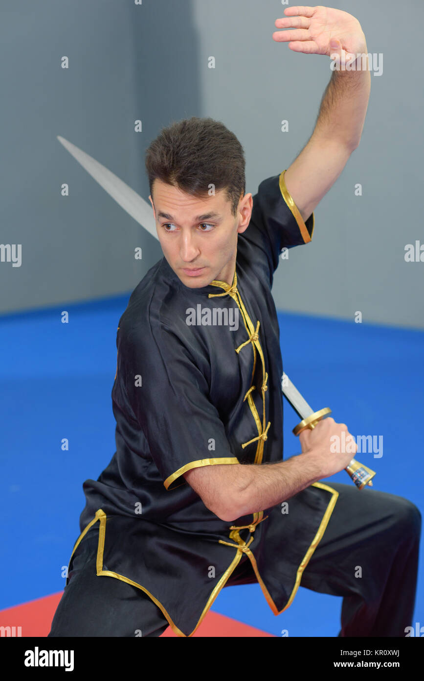 Martial arts expert using a sword Stock Photo Alamy