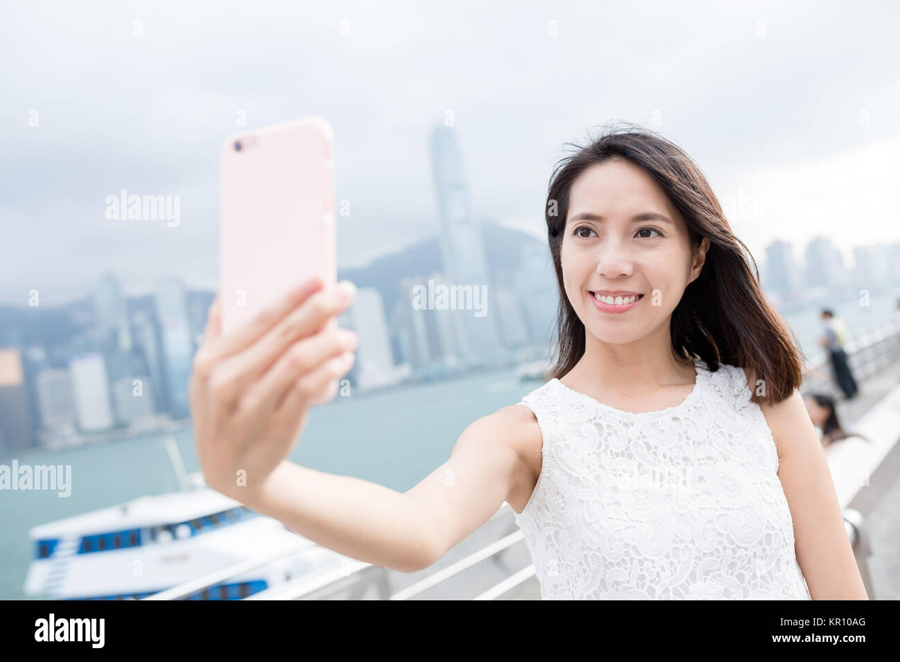 Woman take self picture in landmark of Hong Kong Stock Photo - Alamy