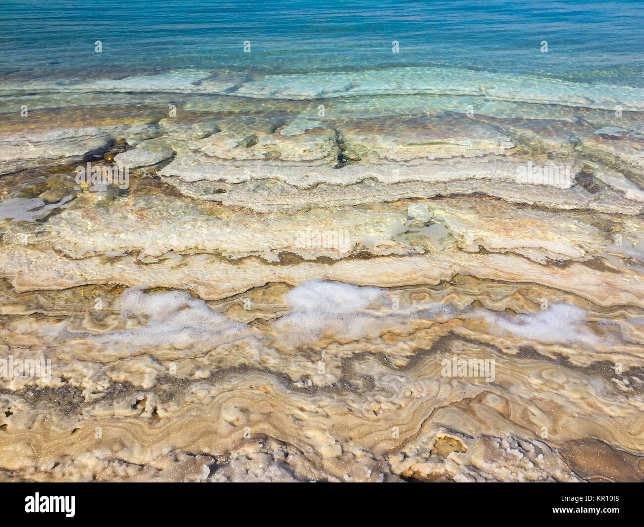 dead sea beach - sand and salt layers  , Stock Photo