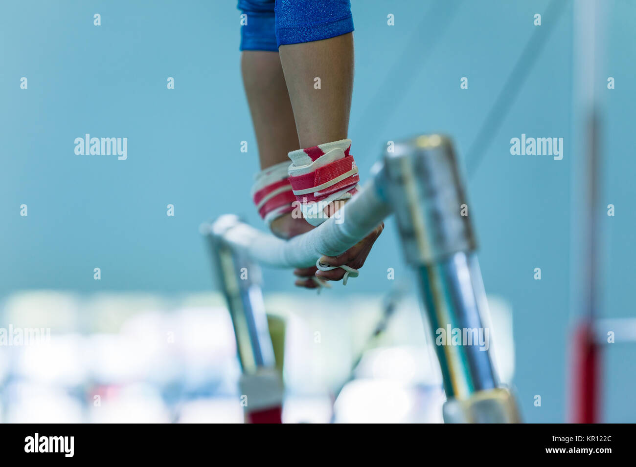 Gymnastics girl gymnast hands leather wrist straps holding parallel