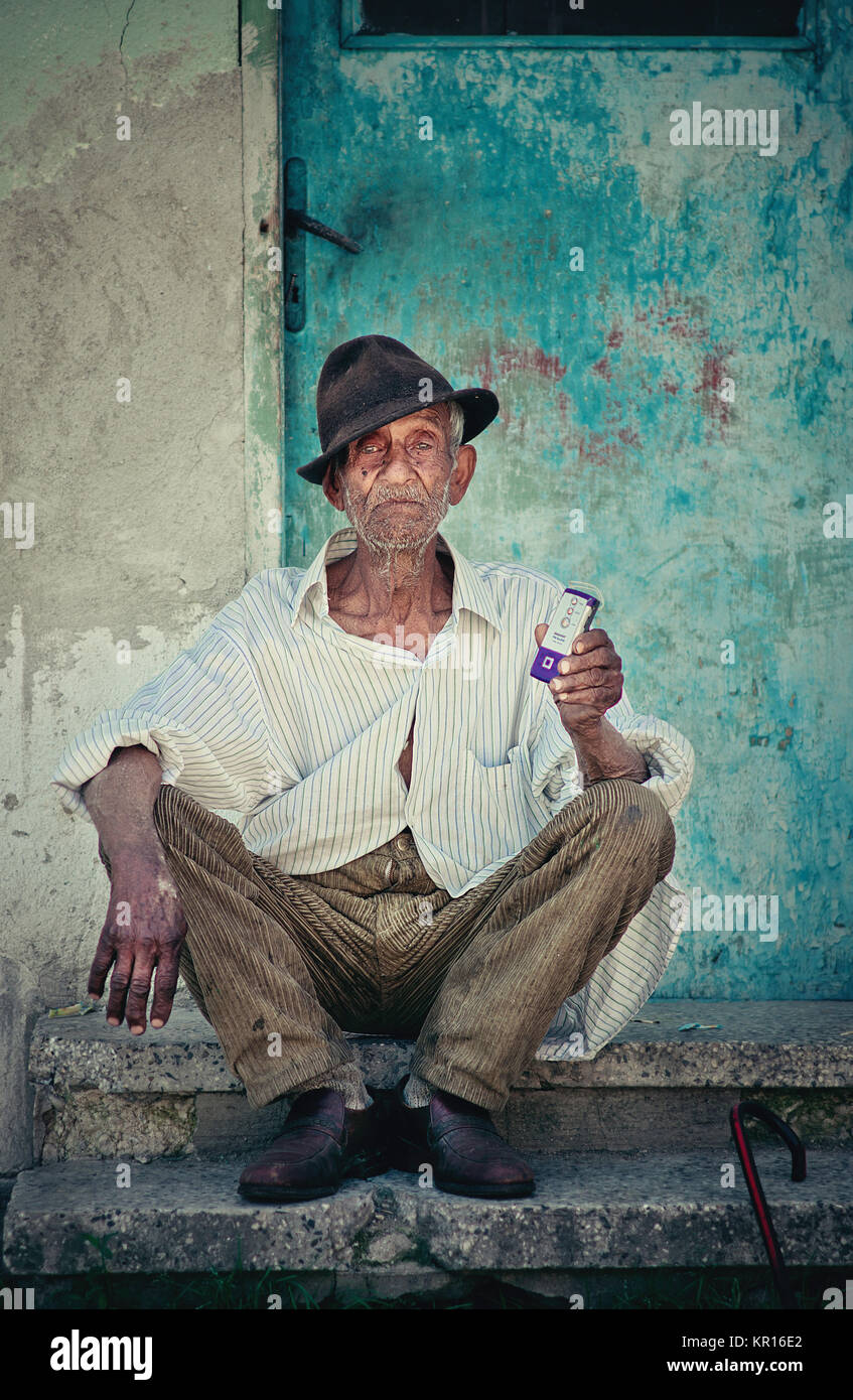 Portrait of an old Bulgarian gypsy man. Vibrant colorful portrait Stock Photo