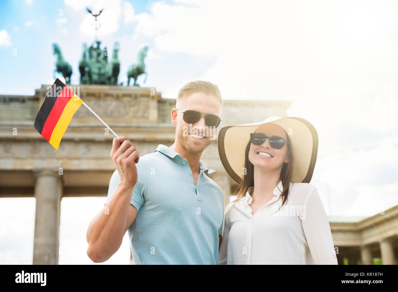 Happy Couple Holding German Flag Stock Photo