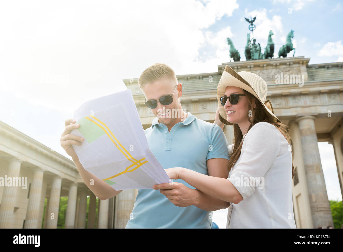 Young Couple Looking At Map Stock Photo