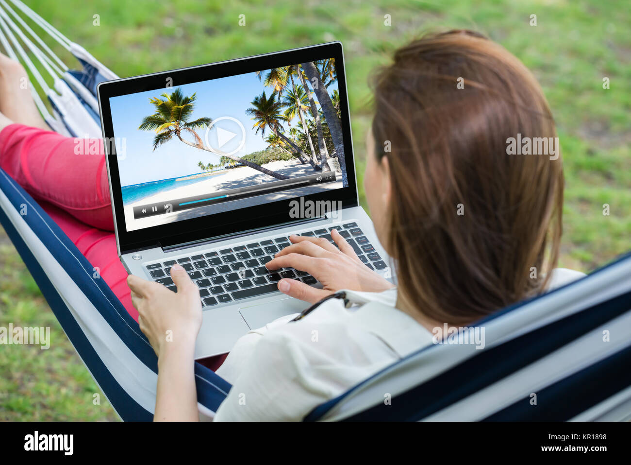 Watch Video Using A Computer Woman Watching Video On Laptop Stock Photo - Alamy