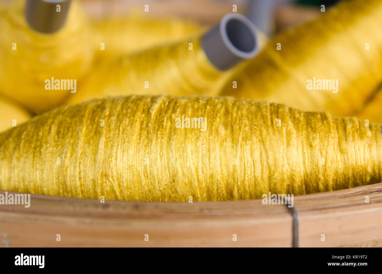 Sewing threads golden color Stock Photo - Alamy