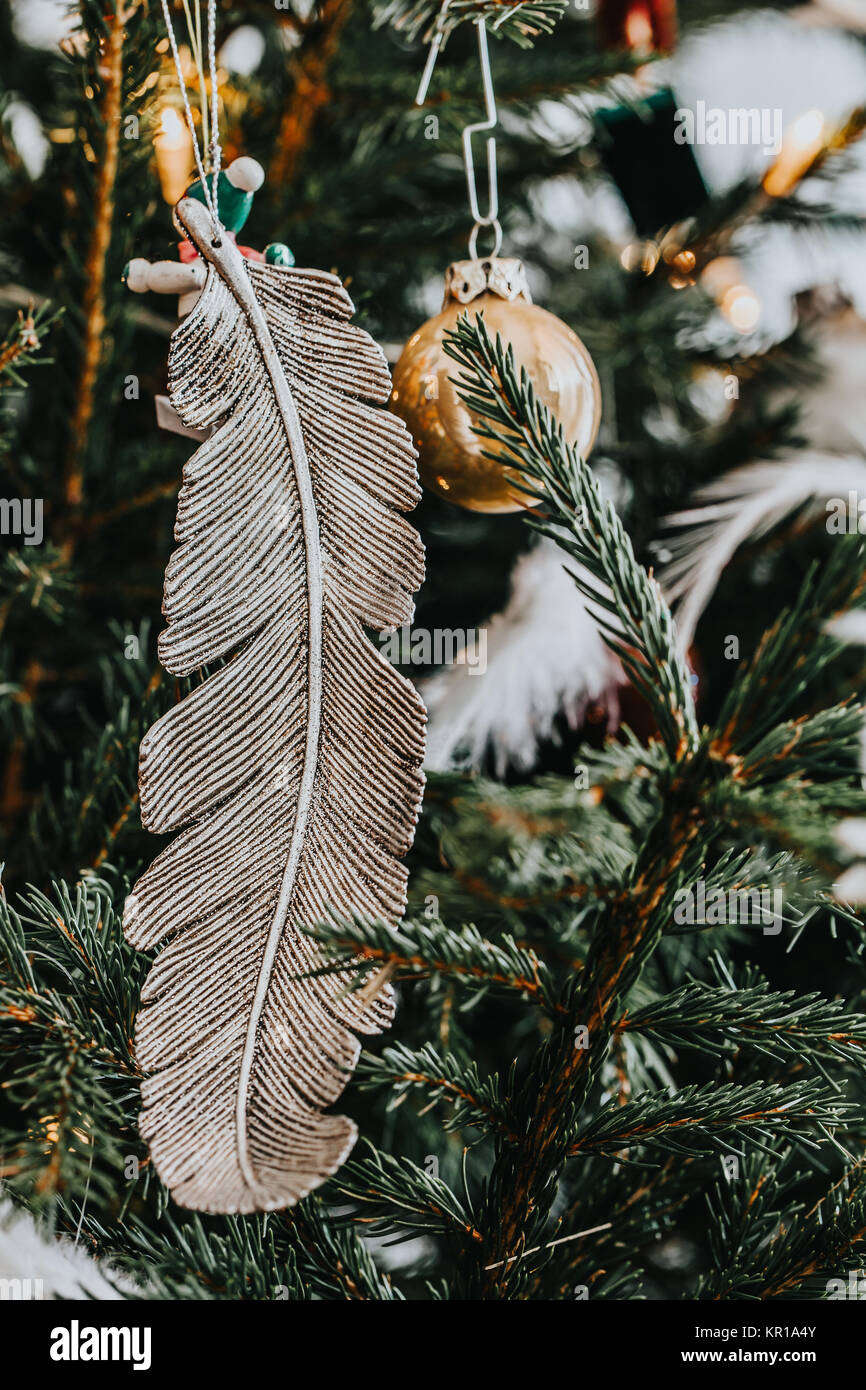 Baubles and decorations hanging on a Christmas tree Stock Photo - Alamy