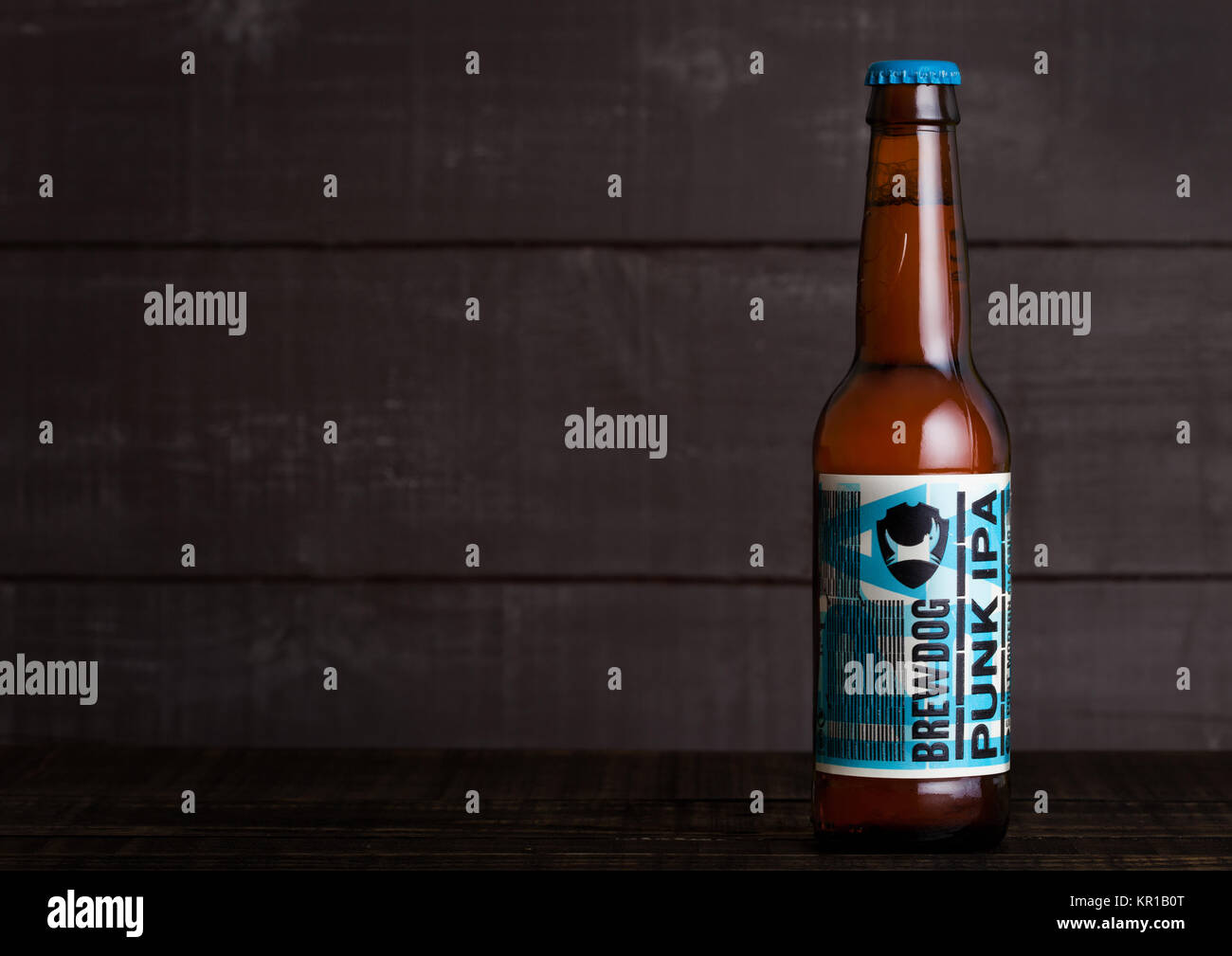 LONDON, UK - DECEMBER 15, 2017: Bottle of Punk Ipa post modern classic, from the Brewdog brewery on wooden background. Stock Photo