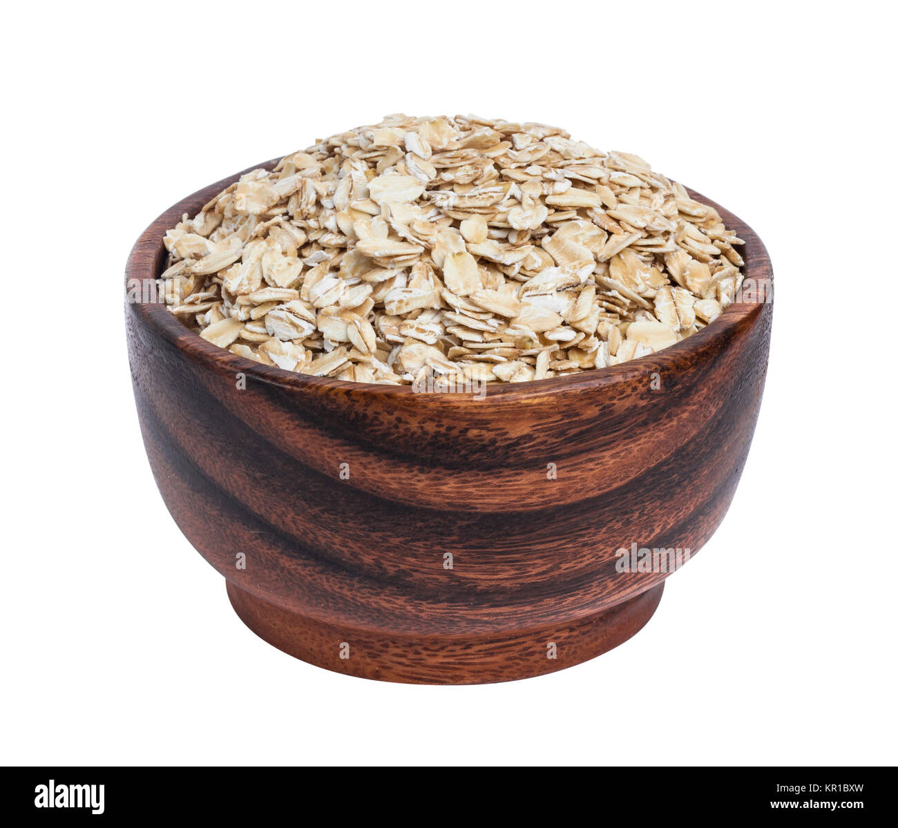 Isolated oatmeal. Oat flakes in wooden bowl on white background Stock Photo