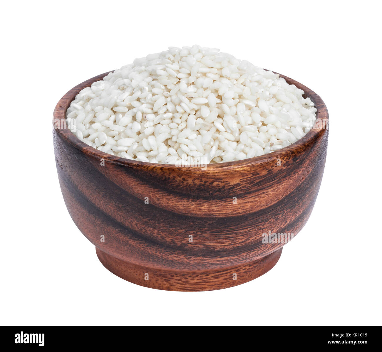Risotto rice in wooden bowl isolated on white background Stock Photo