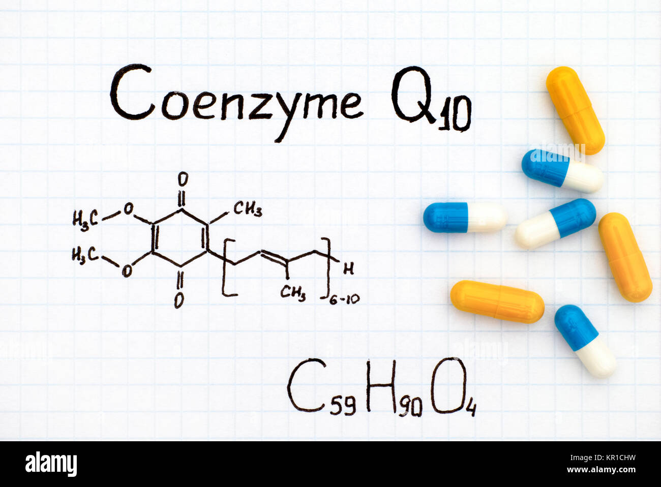 Chemical formula of Coenzyme Q10 with some pills. Closeup Stock Photo
