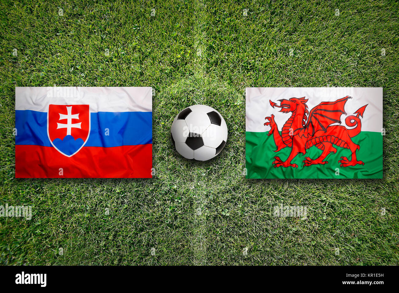 Slovakia vs. Wales flags on soccer field Stock Photo Alamy