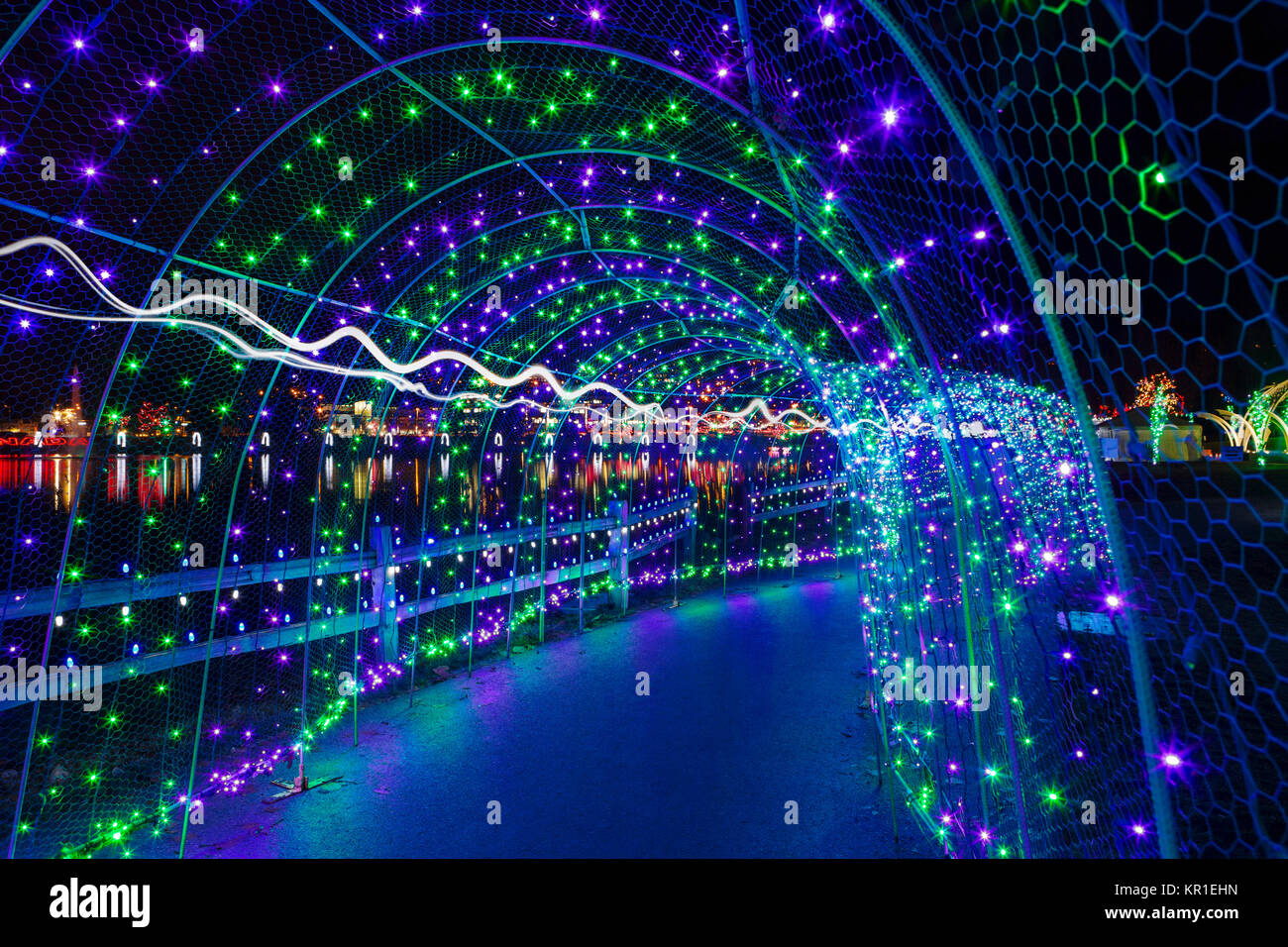 Christmas lights in tunnel along Lafarge Lake in Coquitlam British Columbia Canada at night Stock Photo