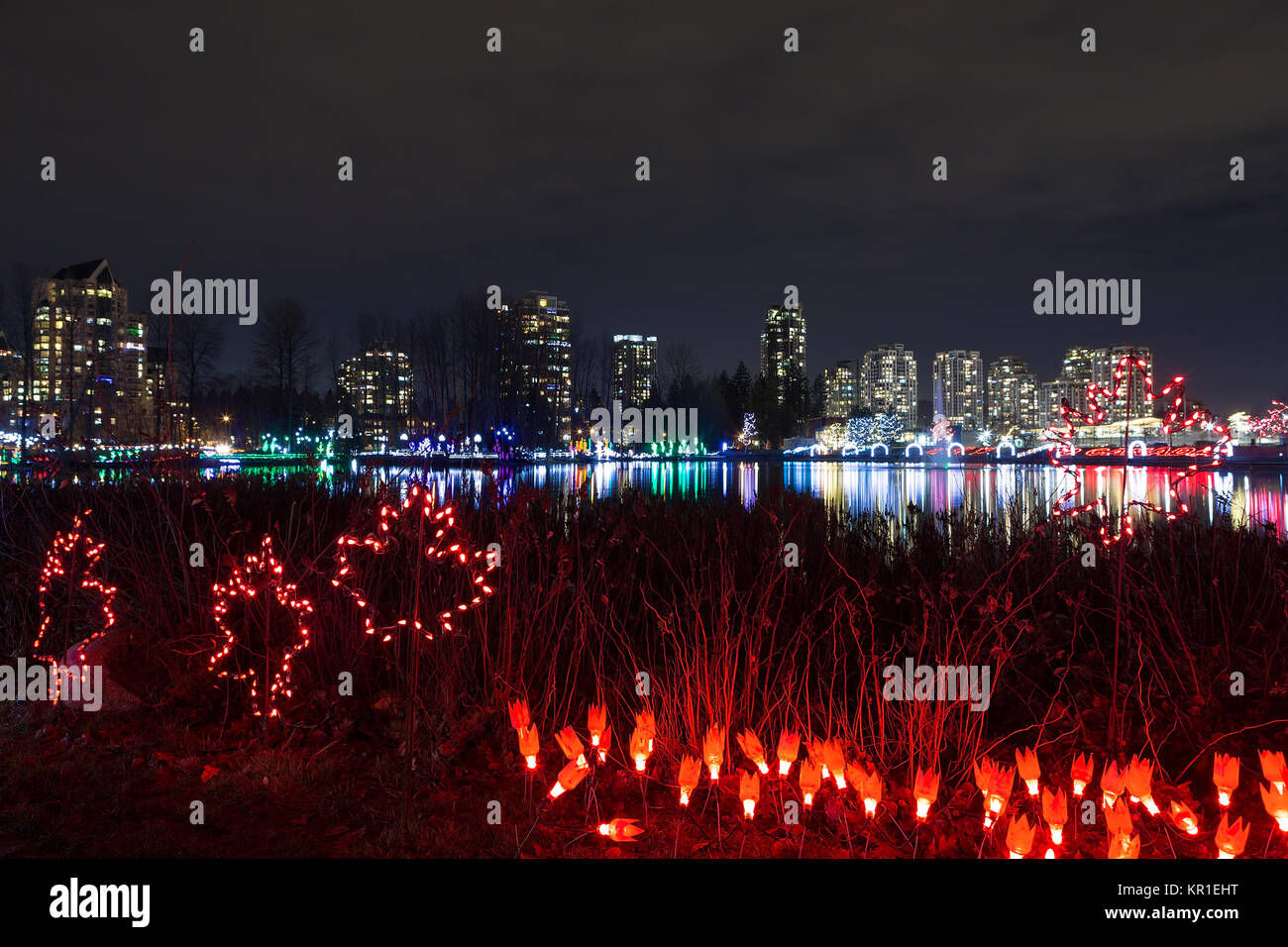 Christmas lights decoration along Lafarge Lake in city center of Coquitlam British Columbia Canada at night Stock Photo