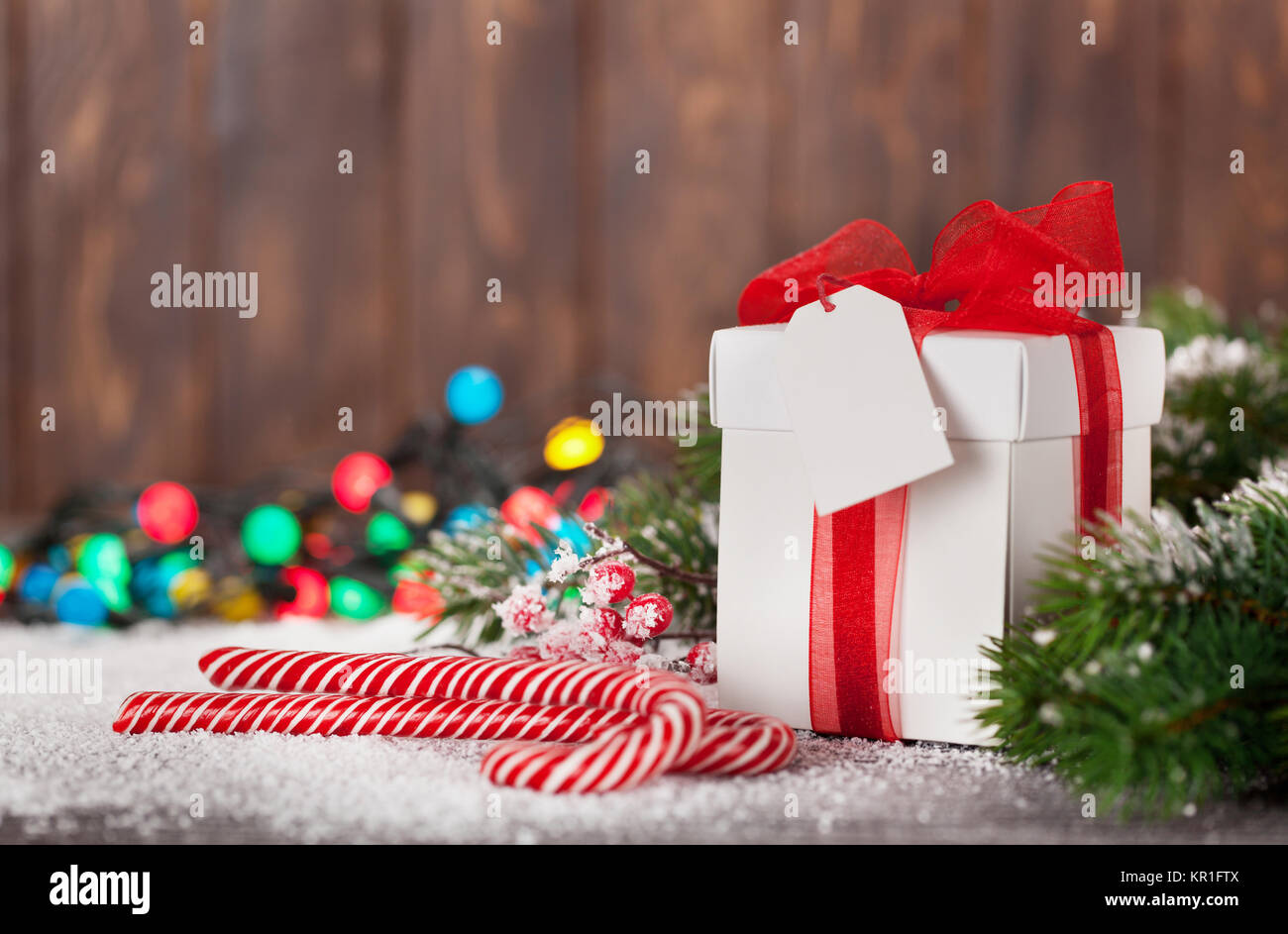 Christmas gift box, candy canes and snow fir tree. Xmas greeting card ...