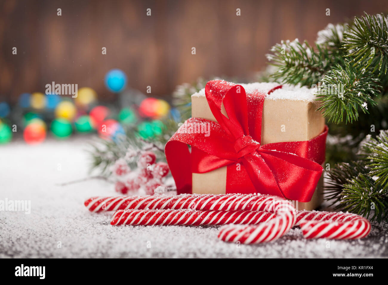 Christmas gift box, candy canes and snow fir tree. Xmas greeting card ...
