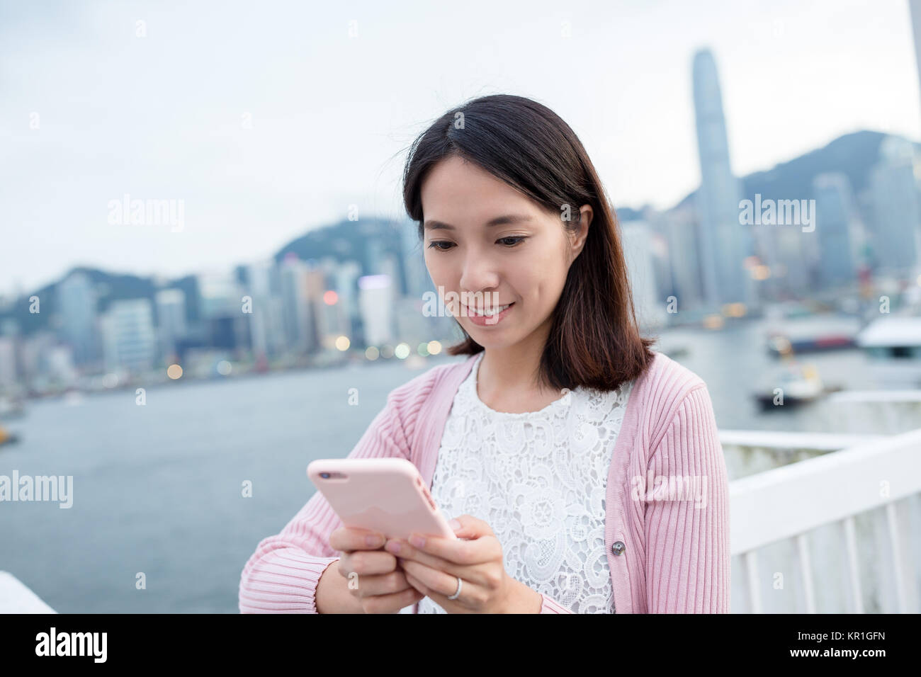 Asian woman use of mobile phone Stock Photo - Alamy