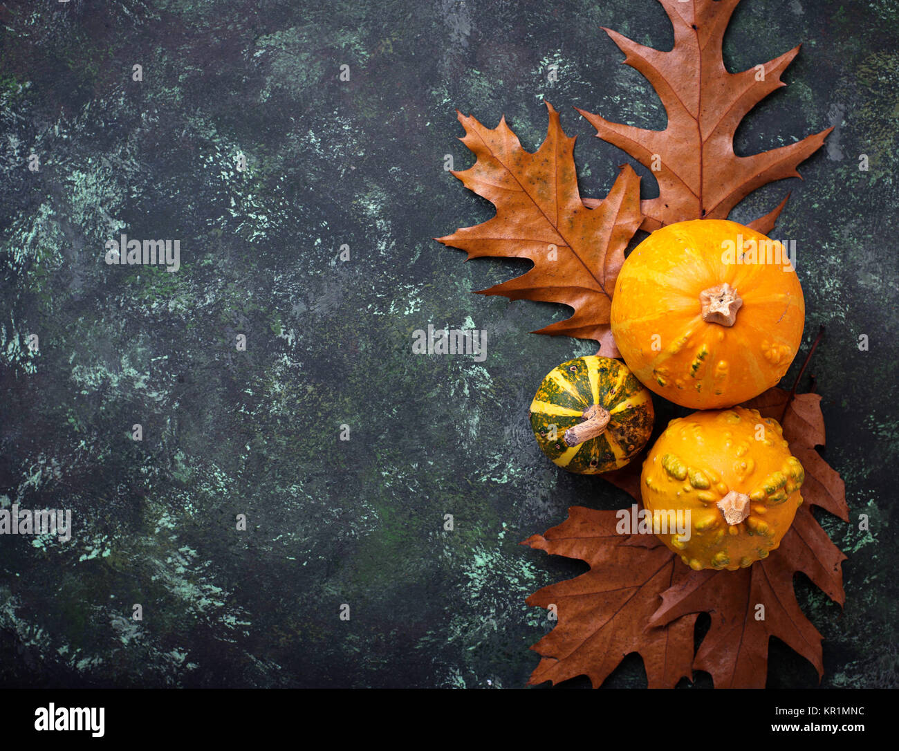 Autumn background with pumpkins and dried leaves Stock Photo - Alamy
