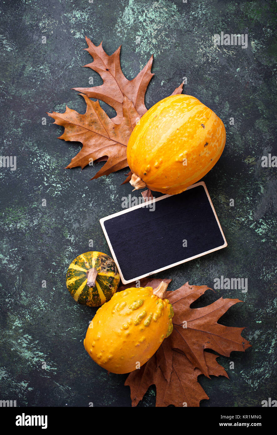 Autumn background with pumpkins and dried leaves Stock Photo - Alamy