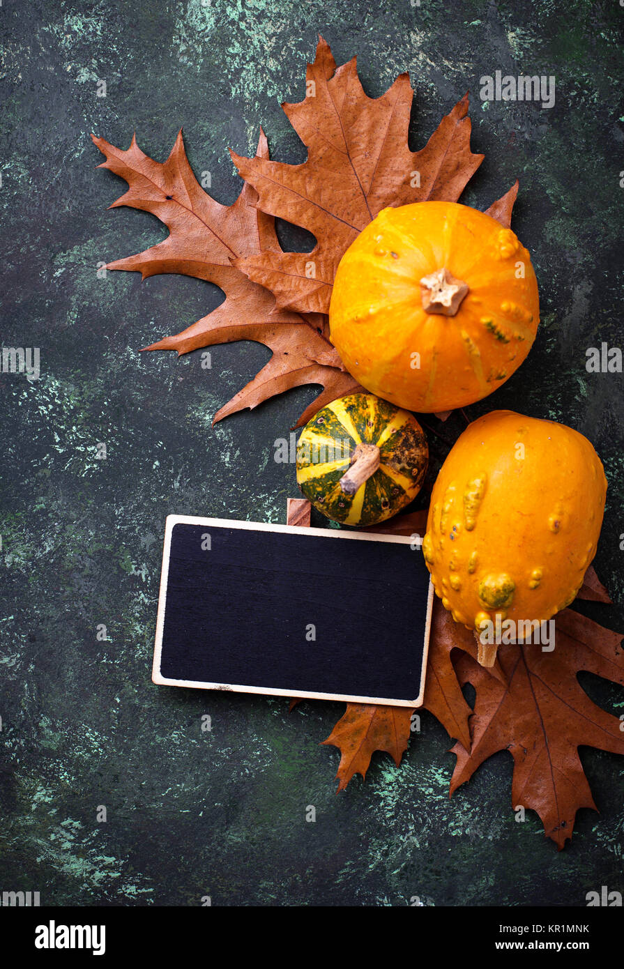 Autumn background with pumpkins and dried leaves Stock Photo - Alamy