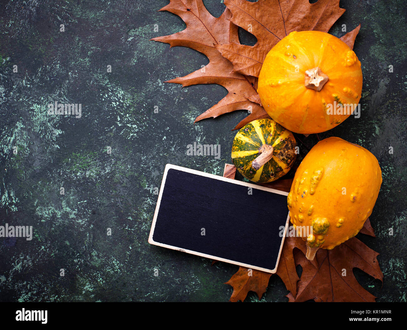 Autumn background with pumpkins and dried leaves Stock Photo - Alamy