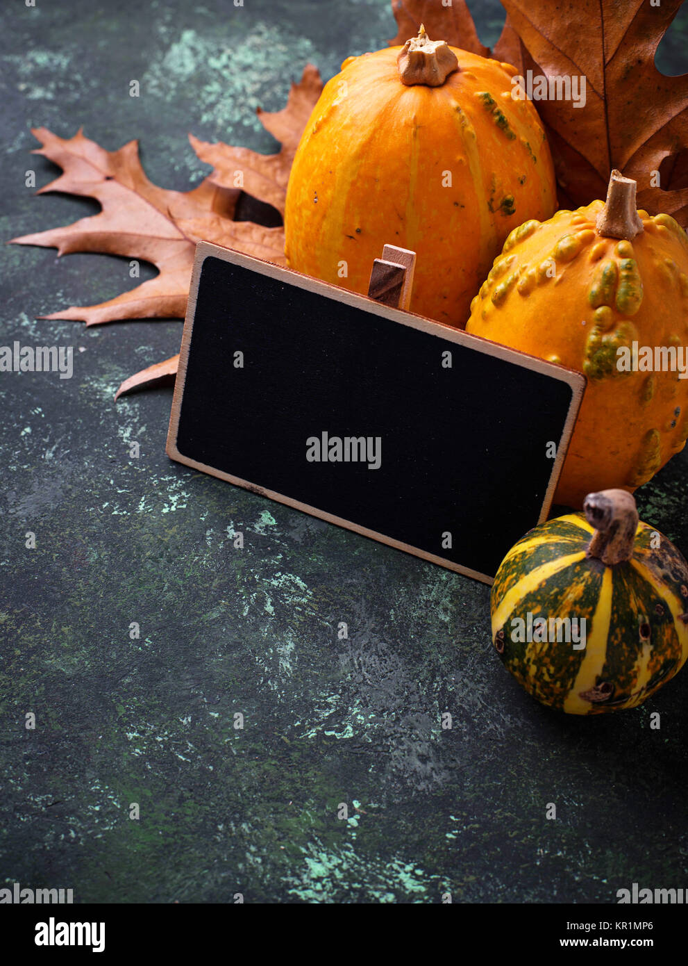 Autumn background with pumpkins and dried leaves Stock Photo - Alamy