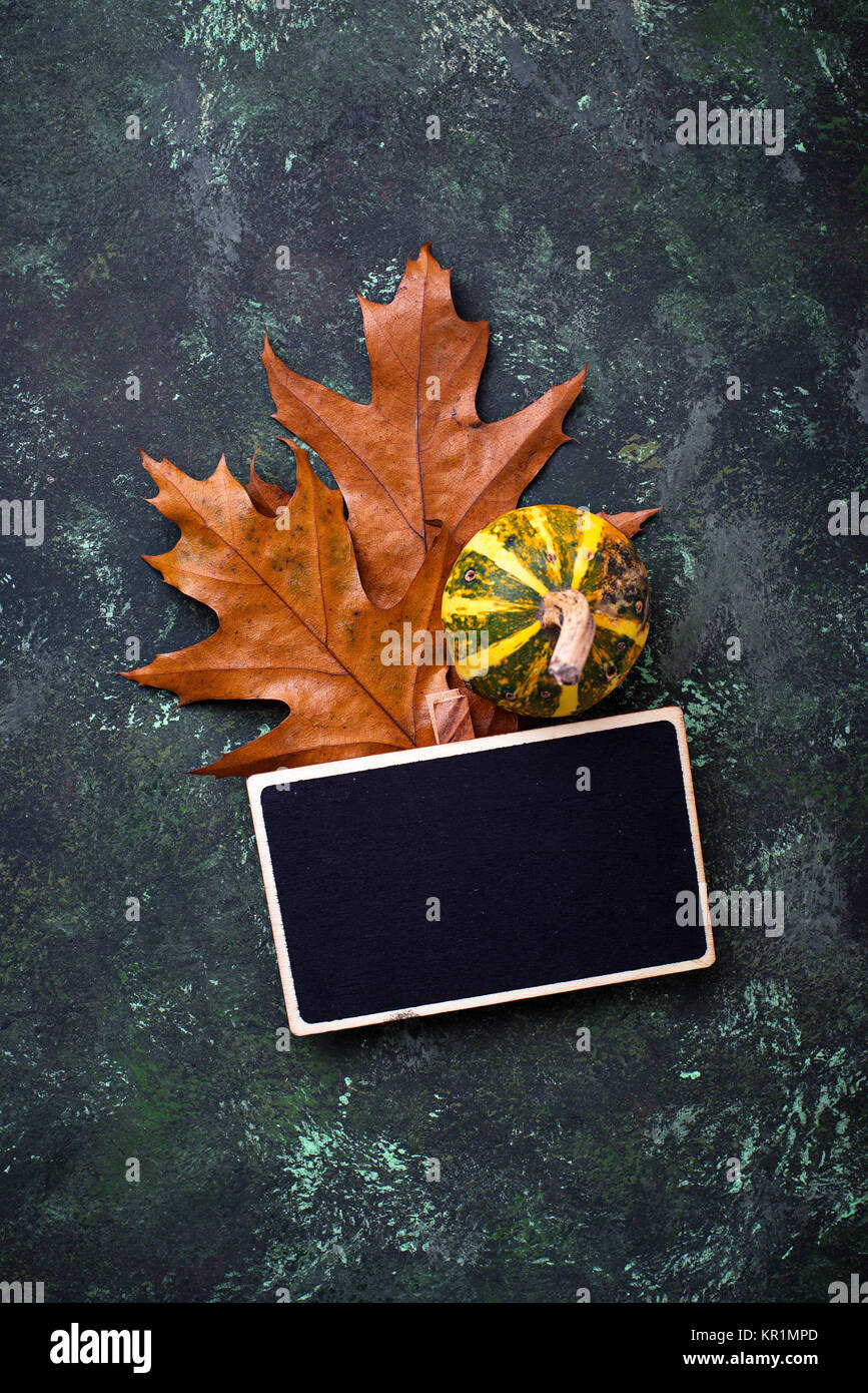 Autumn background with pumpkins and dried leaves Stock Photo - Alamy