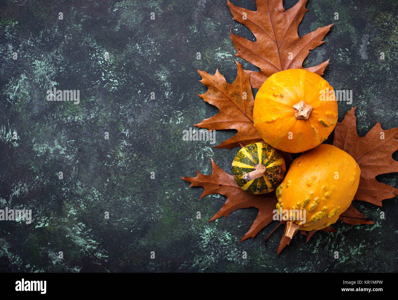 Autumn background with pumpkins and dried leaves Stock Photo - Alamy