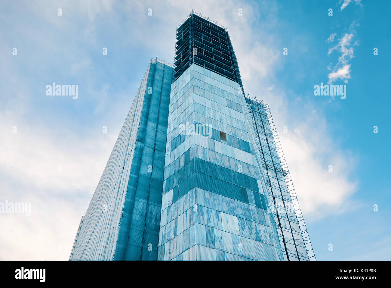 Skyscraper under construction and blue sky Stock Photo - Alamy