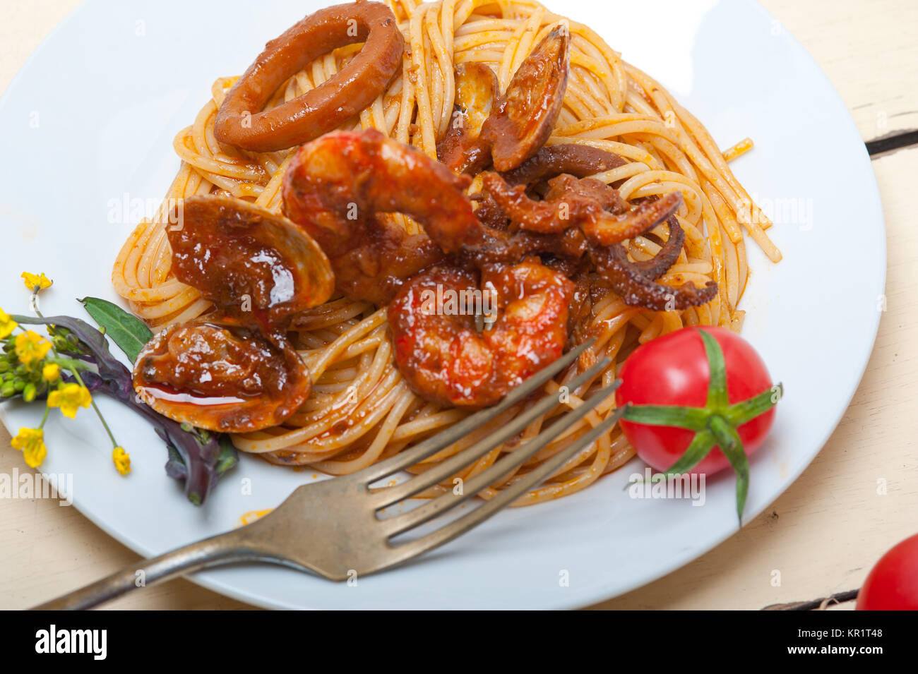 Italian seafood spaghetti pasta on red tomato sauce Stock Photo - Alamy
