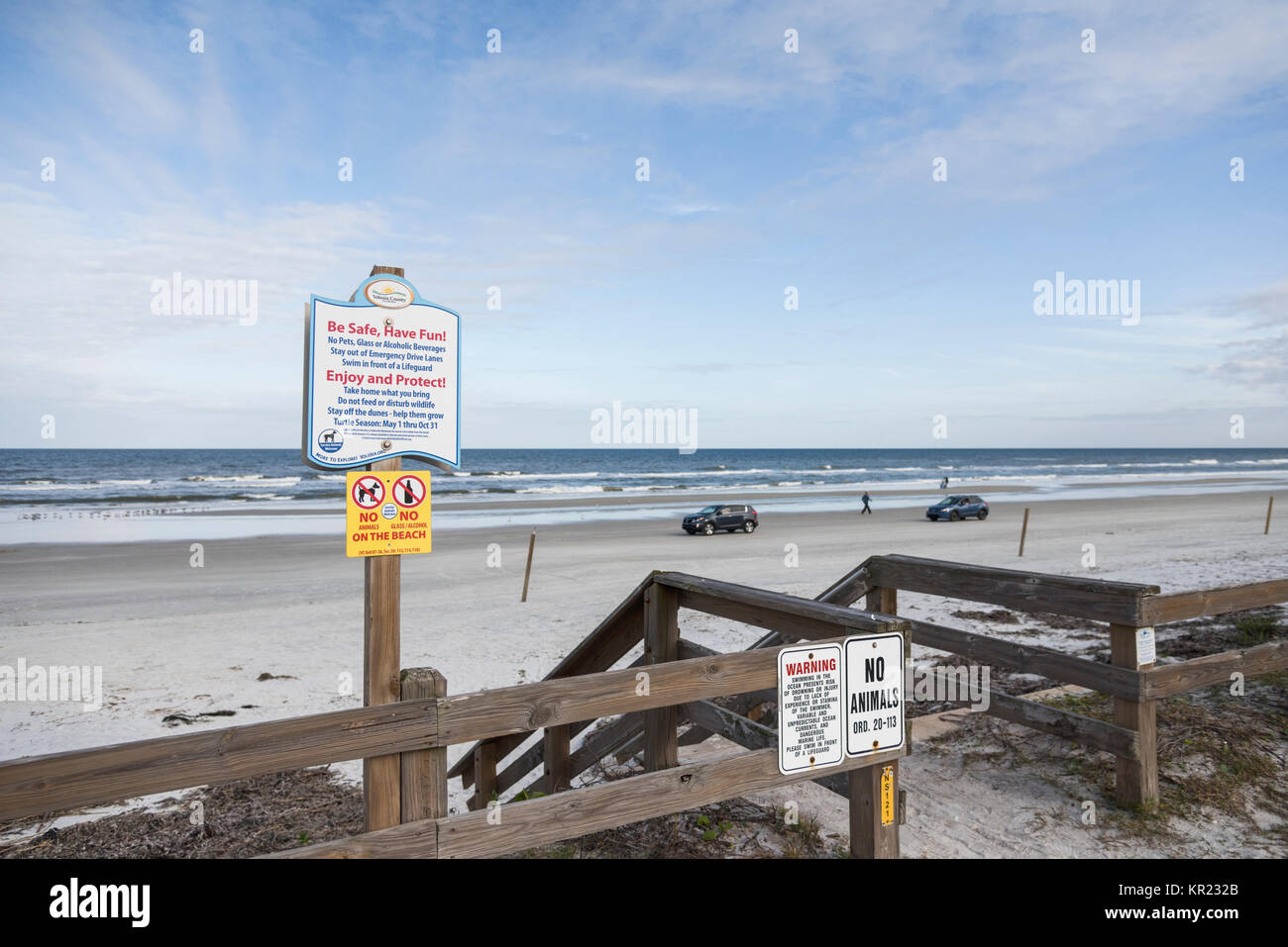 Warning signs posted at the entrance to New Smyrna Beach Florida USA Stock Photo
