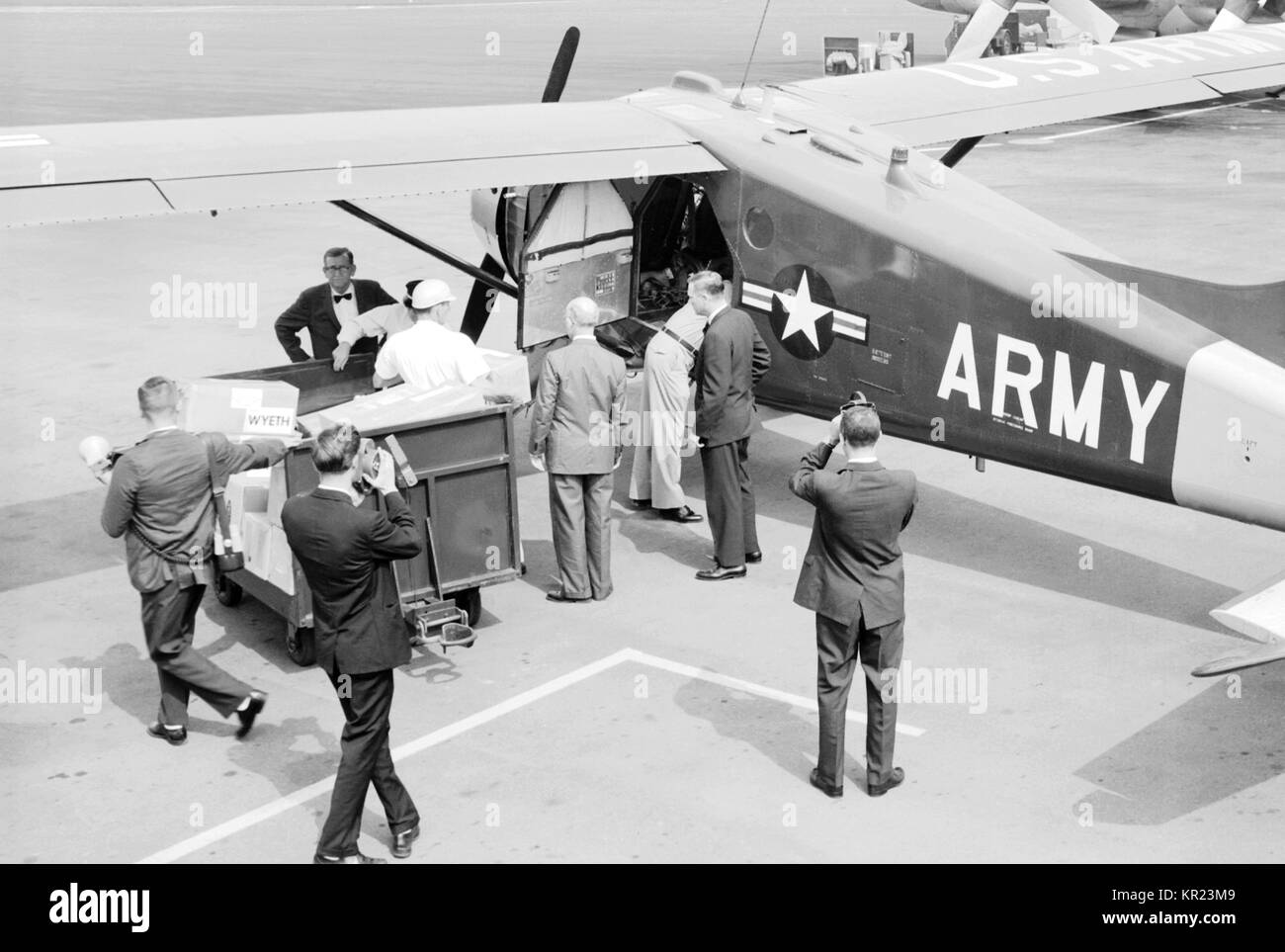 The Alabama National Guard prepares to fly polio vaccine from Birmingham to Haleyvilled during the epidemic of 1963, 1963. In the early 1950's, there were more than 20, 000 cases of polio each year. After polio vaccination began in 1955, cases dropped significantly. By 1960, the number of cases dropped to about 3, 000, and by 1979 there were only about 10. Image courtesy CDC/Mr. Stafford Smith. Stock Photo