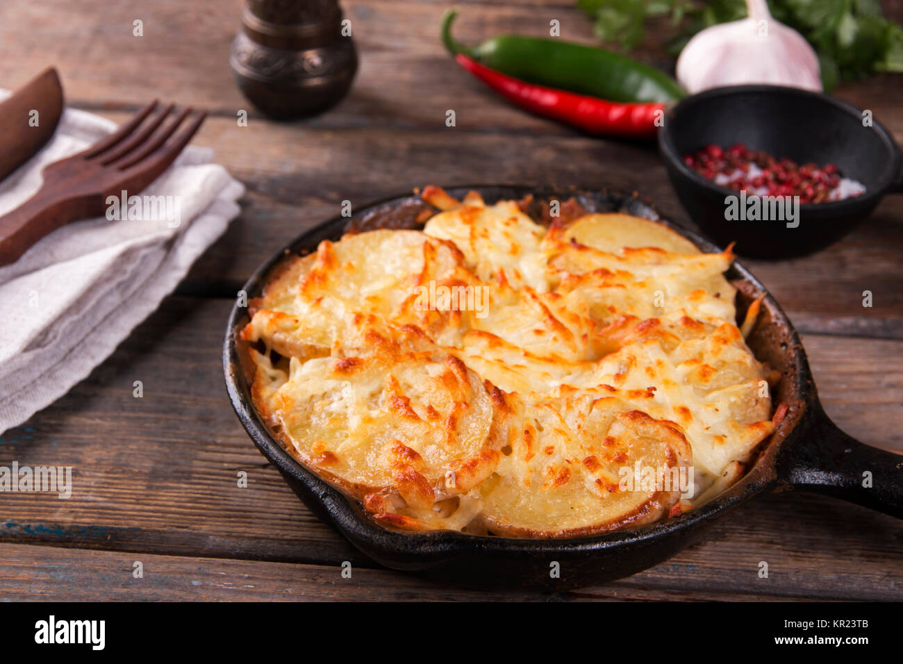 potato casserole with cheese in a frying pan serving vegetarian dish homemade Stock Photo