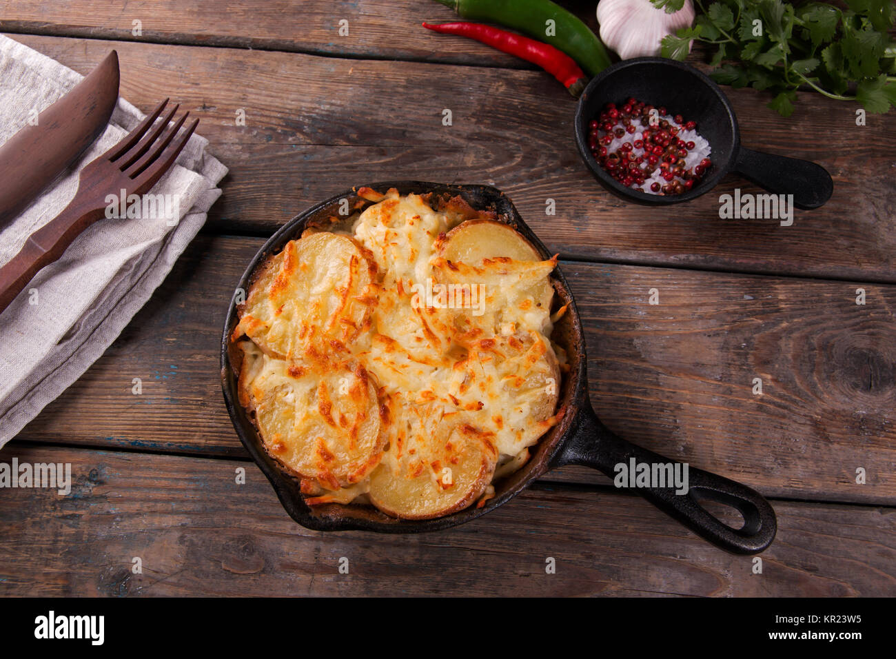 potato casserole with cheese in a frying pan serving vegetarian dish homemade Stock Photo