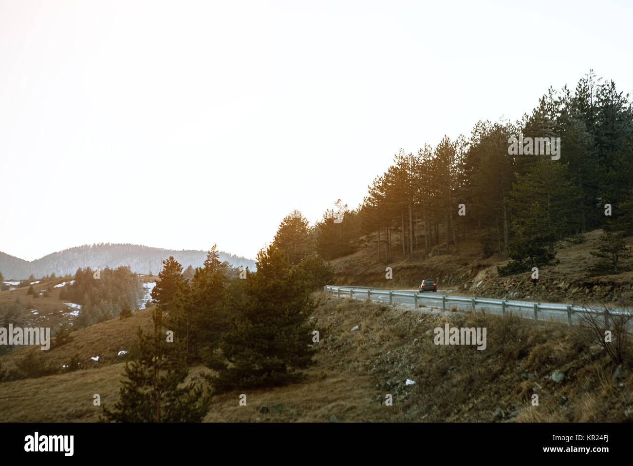 Car drives on winding road on mountain for vacation Stock Photo